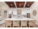Open kitchen boasting white cabinets, a large island, and stylish backsplash at 245 W Sagebrush St, Gilbert, AZ 85233