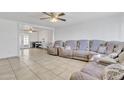 Open living area with tile floors and views into adjacent rooms at 3144 N 81St Dr, Phoenix, AZ 85033