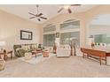 Relaxing living room with ample natural light and seating at 37110 W Leonessa Ave, Maricopa, AZ 85138