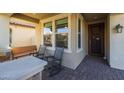 Covered porch with rocking chairs and a wooden bench at 3841 E Patrick St, Gilbert, AZ 85295