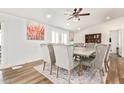 Elegant dining room with a large table and seating for eight at 43459 N Terrace View Ave, San Tan Valley, AZ 85140