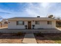Front view of a remodeled home with new landscaping at 521 E Lehi Rd, Mesa, AZ 85203