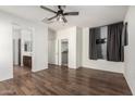 Large primary bedroom with hardwood floors, a ceiling fan, and a walk-in closet at 5374 W Chisum Trl, Phoenix, AZ 85083