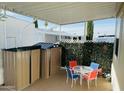 Covered patio featuring an outdoor dining set and storage shed, perfect for relaxation and convenience at 8700 E University Dr # 1315, Mesa, AZ 85207