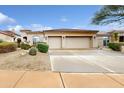 Single-story home with three-car garage and desert landscaping at 9687 E Cavalry Dr, Scottsdale, AZ 85262