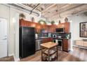 Modern kitchen with wood cabinets and granite countertops at 114 W Adams St # 807, Phoenix, AZ 85003