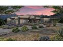 Elegant home with stone accents and a landscaped yard at 15728 N Mountain Pkwy, Fountain Hills, AZ 85268