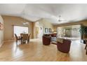 Bright and spacious living room with hardwood floors and access to backyard at 19504 N 88Th Dr, Peoria, AZ 85382
