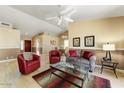 Open living room featuring hardwood floors, neutral walls, and comfy furniture at 19504 N 88Th Dr, Peoria, AZ 85382