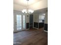 Bright dining room with chandelier and hardwood floors at 2929 E Broadway Rd # 44, Mesa, AZ 85204