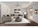 Virtually staged living room features a neutral color palette and comfortable sectional sofa at 3619 E Monterosa St # 102, Phoenix, AZ 85018