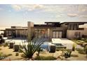 Contemporary home with a pool, desert landscaping, and a fenced backyard at 36420 N 105Th Pl, Scottsdale, AZ 85262