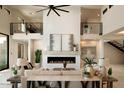 Spacious living room with a double-sided fireplace and high ceilings at 36420 N 105Th Pl, Scottsdale, AZ 85262
