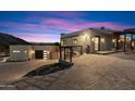 Modern home with paver driveway and garage at 4401 E Sunset Dr, Phoenix, AZ 85028