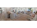 Open concept dining room with modern table and chairs at 4601 E Solano Dr, Phoenix, AZ 85018
