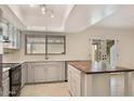 Bright kitchen featuring an island and backyard access at 6031 E Evans Dr, Scottsdale, AZ 85254