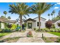 Beautiful home with meticulously maintained landscaping, a striking front entrance and a stone walkway at 6235 E Montecito Ave, Scottsdale, AZ 85251