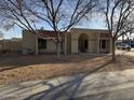 House exterior showcasing a tan stucco facade, red tile roof, and landscaping at 717 W Chilton St, Chandler, AZ 85225