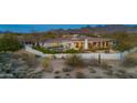 Luxury backyard with private pool, covered patio, mountain views, and desert landscaping at 9045 E Chino Dr, Scottsdale, AZ 85255