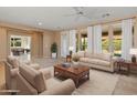 Bright living room with hardwood floors and comfortable seating at 12750 W Jasmine Trl, Peoria, AZ 85383