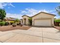Charming single-story home with two-car garage and desert landscaping at 12937 W Highland Ave, Litchfield Park, AZ 85340