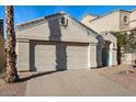 Exterior shot of the two car garage of the home at 15858 S 11Th Pl, Phoenix, AZ 85048