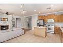 Open concept kitchen with island and stainless steel appliances at 19423 E Reins Rd, Queen Creek, AZ 85142