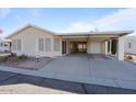 Front view of a tan house with carport at 215 N Power Rd # 440, Mesa, AZ 85205