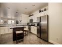 Modern kitchen with stainless steel appliances and an island at 25745 N 163Rd Dr, Surprise, AZ 85387