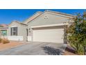Charming single-story home featuring neutral stucco and a two-car garage at 3481 N 309Th Ln, Buckeye, AZ 85396