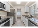 Kitchen boasts granite countertops and stainless steel appliances at 6547 N 3Rd Ave, Phoenix, AZ 85013