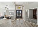 Bright and spacious entryway with elegant double doors and hardwood floors at 1714 E Saltsage Dr, Phoenix, AZ 85048