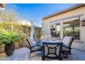 Relaxing patio features a table and chairs, ideal for al fresco dining at 189 E Atacama Ln, Queen Creek, AZ 85140
