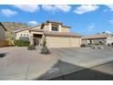 Two-story house with a three-car garage and desert landscaping at 20443 N 17Th Way, Phoenix, AZ 85024