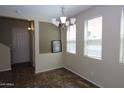 Bright dining room with tile flooring and a chandelier at 3254 E Sports Dr, Gilbert, AZ 85298