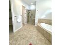 Bathroom with soaking tub and walk-in shower at 4213 E Edgemont Ave, Phoenix, AZ 85008