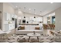 Open concept kitchen with white cabinets and modern appliances at 532 E Tanglewood Trl, Phoenix, AZ 85085