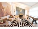 Bright living room with stylish furniture and large art at 6127 E Mescal St, Scottsdale, AZ 85254