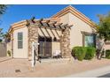 Single-story home with a pergola-covered patio and landscaping at 6202 E Mckellips Rd # 117, Mesa, AZ 85215