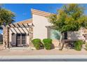 Single-story home with a charming front patio and landscaping at 6202 E Mckellips Rd # 117, Mesa, AZ 85215