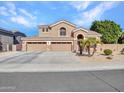 Two-story house featuring a three-car garage and desert landscaping at 6868 W Cottontail Ln, Peoria, AZ 85383