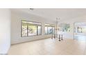 Spacious dining room with large windows and chandelier at 8227 E Sierra Pinta Dr, Scottsdale, AZ 85255