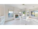 Cozy Gathering room featuring a fireplace and built-in shelving at 8227 E Sierra Pinta Dr, Scottsdale, AZ 85255