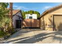 View of a large RV gate in front of a house at 8642 W Harmony Ln, Peoria, AZ 85382