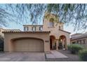 Charming home featuring a two-car garage and an inviting front porch with seating at 9305 E Canyon View Rd, Scottsdale, AZ 85255