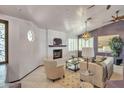 Spacious living room featuring a fireplace and comfortable seating at 931 N Senate St, Chandler, AZ 85225