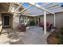 Covered patio with seating area, offering a relaxing outdoor space at 14040 E Ocotillo Rd, Chandler, AZ 85249