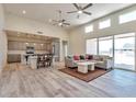 Open concept kitchen and living area with island and gray cabinets at 14825 S Charco Rd, Arizona City, AZ 85123