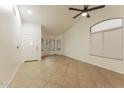 Spacious living room with tile floors and multiple windows at 15877 W Diamond St, Goodyear, AZ 85338