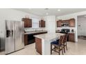 Modern kitchen featuring granite countertops and stainless steel appliances at 1673 E Jardin Pl, Casa Grande, AZ 85122